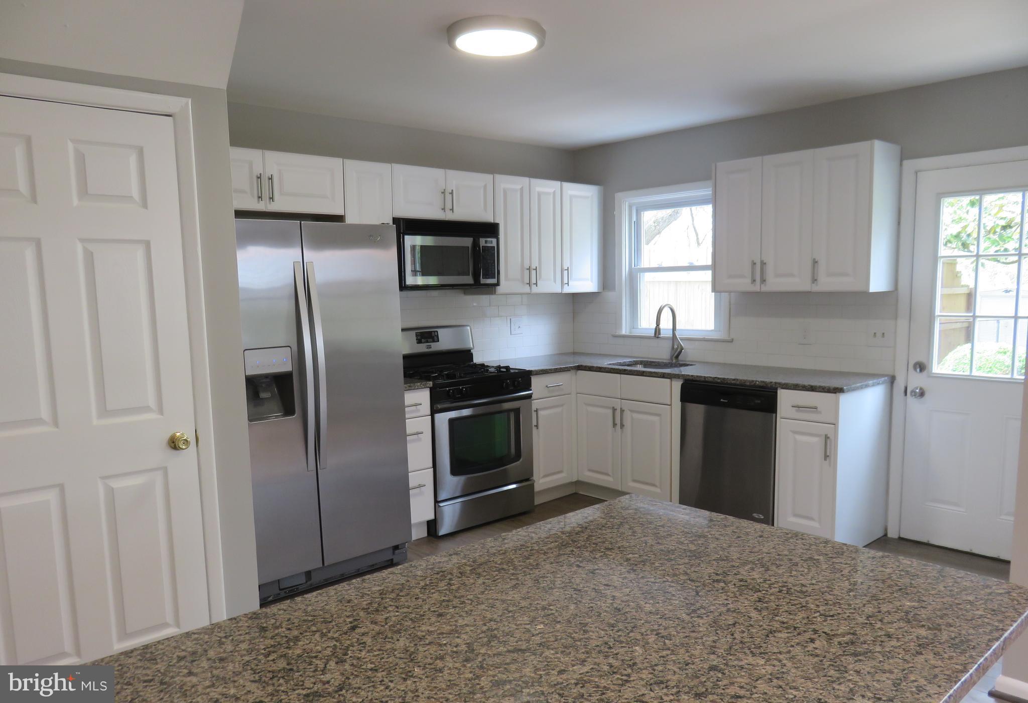 6840 Queens Ferry Road Baltimore, MD 21239 - Photo 14 of 28 ALL STAINLESS APPLIANCES/GRANITE COUNTERS