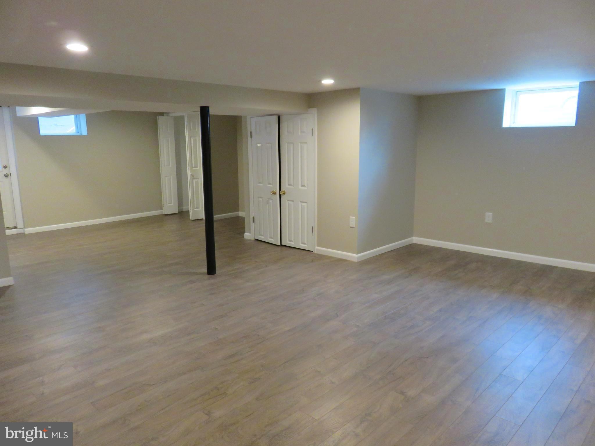 6840 Queens Ferry Road Baltimore, MD 21239 - Photo 21 of 28 LOWER LEVEL FAMILY ROOM GREAT FOR ENTERTAINING