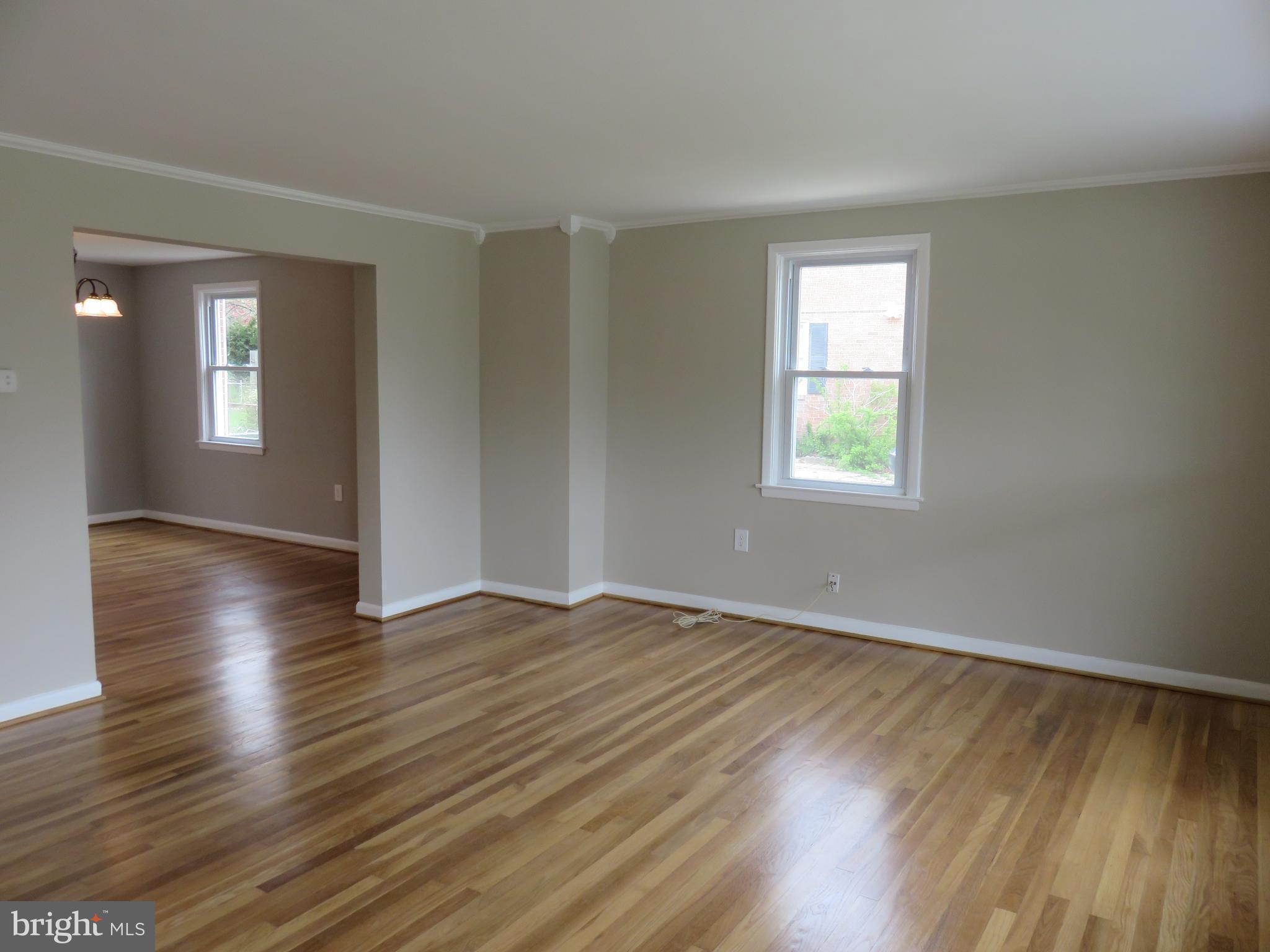 6840 Queens Ferry Road Baltimore, MD 21239 - Photo 7 of 28 SPACIOUS LIVING ROOM WITH CROWN MOLDING