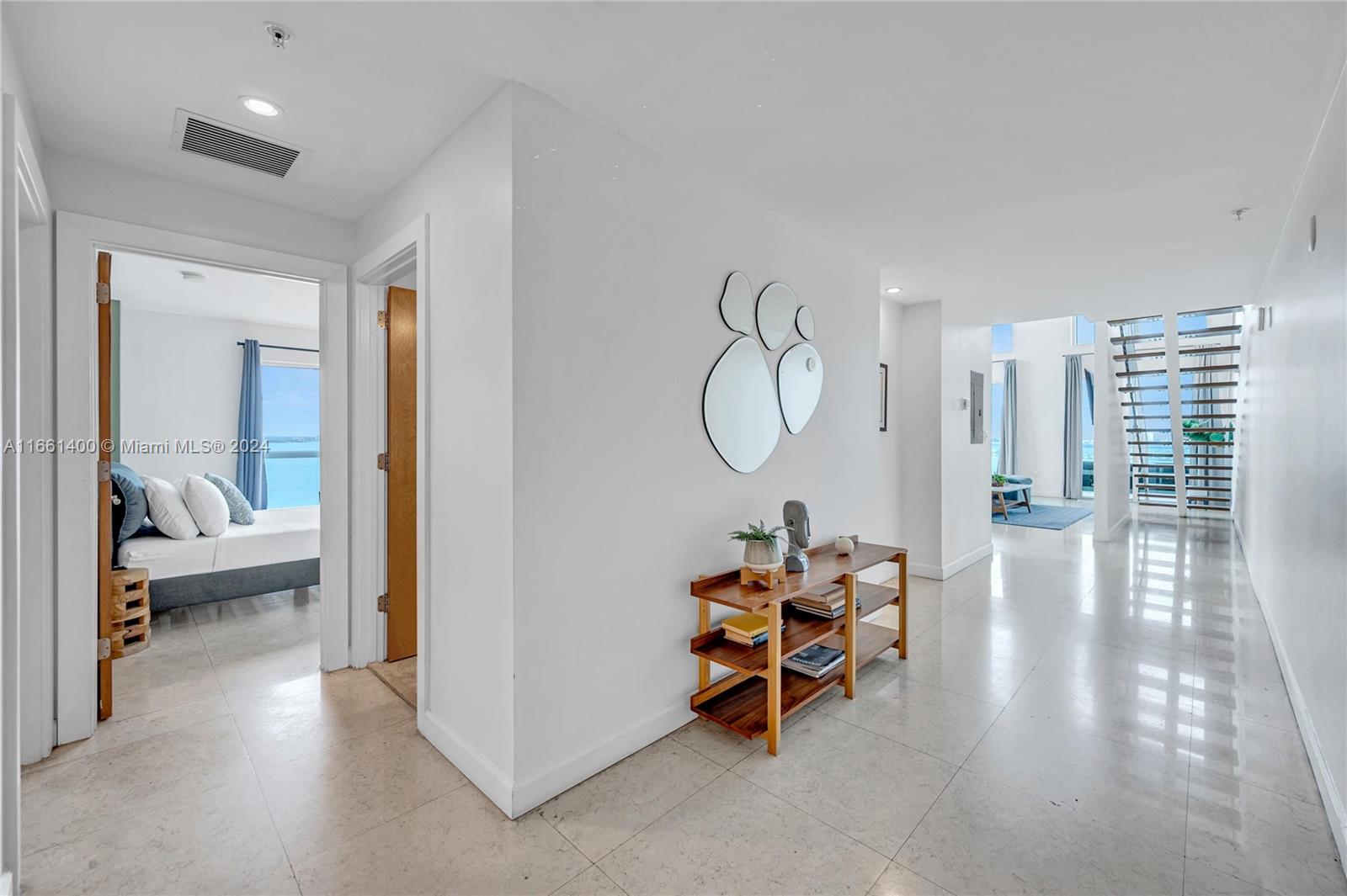 7939 East Drive, Unit 13 North Bay Village, FL 33141 - Photo 18 of 31 a living room with furniture and a large window