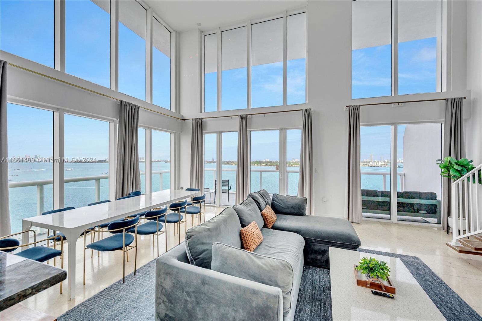 7939 East Drive, Unit 13 North Bay Village, FL 33141 - Photo 21 of 31 a living room with furniture and large windows