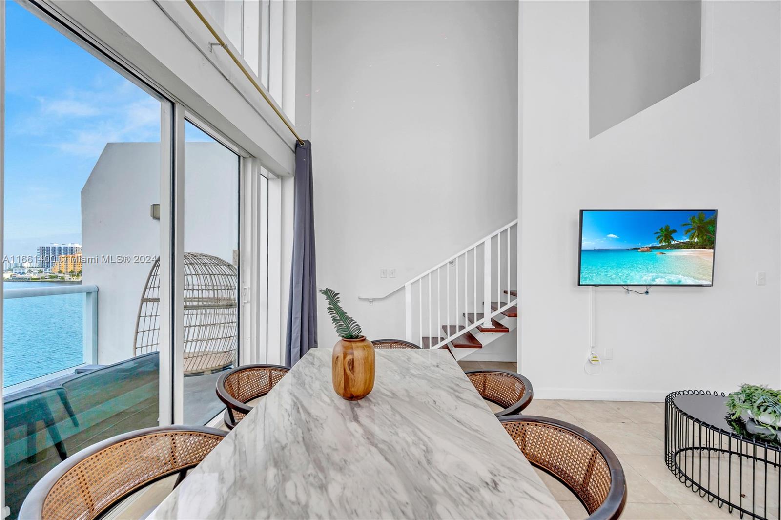 7939 East Drive, Unit 13 North Bay Village, FL 33141 - Photo 27 of 31 a bedroom with furniture and a window