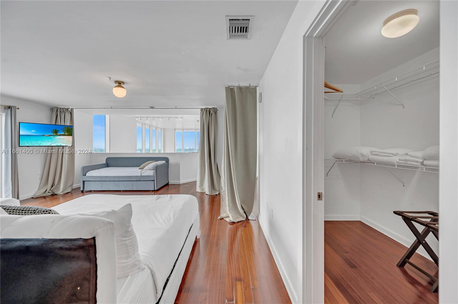7939 East Drive, Unit 13 North Bay Village, FL 33141 - Photo 8 of 31 a view of a kitchen with furniture and a refrigerator
