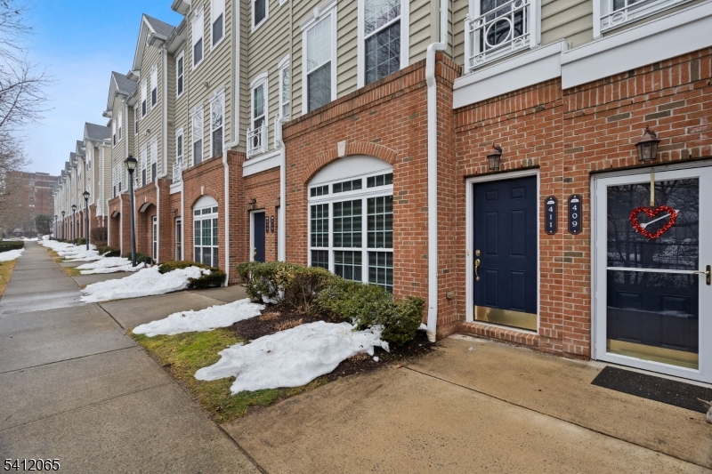 411 Deluca Road, Unit 411 Belleville, NJ 07109 - Photo 1 of 39 a view of a building with potted plants