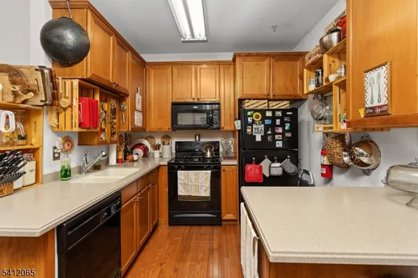 a kitchen that has a lot of cabinets and appliances