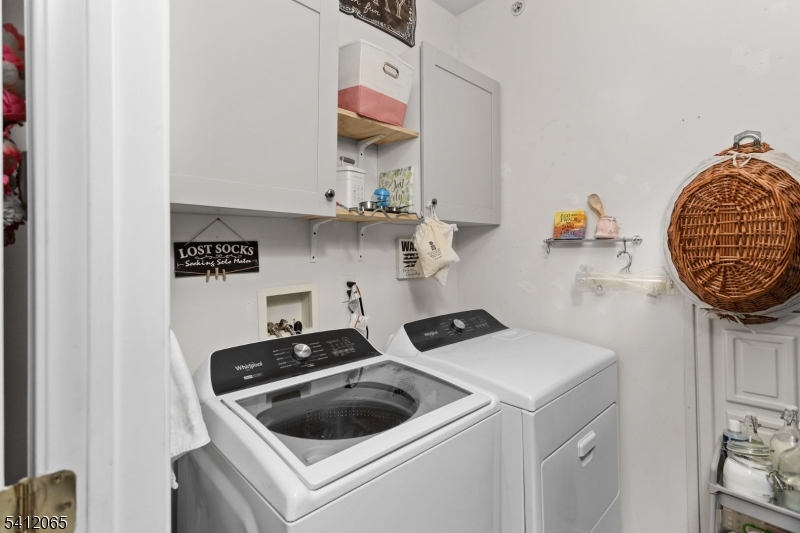 411 Deluca Road, Unit 411 Belleville, NJ 07109 - Photo 29 of 39 a kitchen with a stove and cabinets