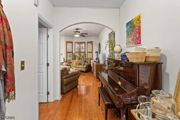 a view of a livingroom with furniture and hardwood floor