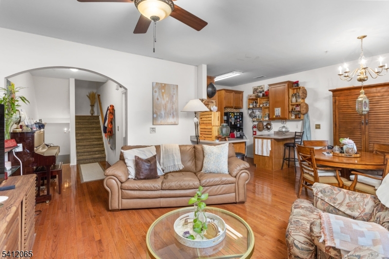411 Deluca Road, Unit 411 Belleville, NJ 07109 - Photo 9 of 39 a living room with furniture and wooden floor