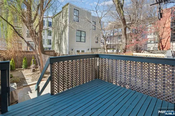 a view of deck with wooden floor and chairs