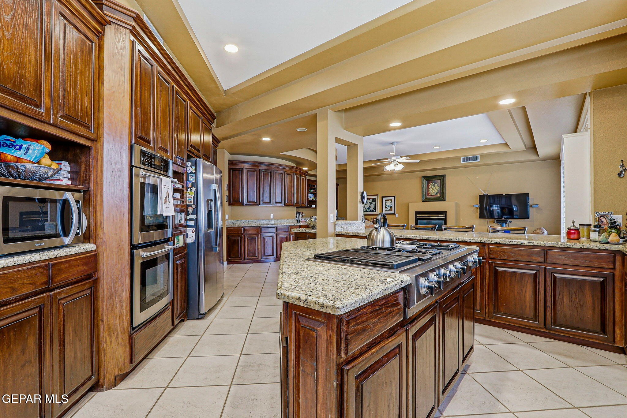 5806 Diamond Point Circle El Paso, TX 79912 - Photo 17 of 61 a kitchen with stainless steel appliances granite countertop a stove and a sink