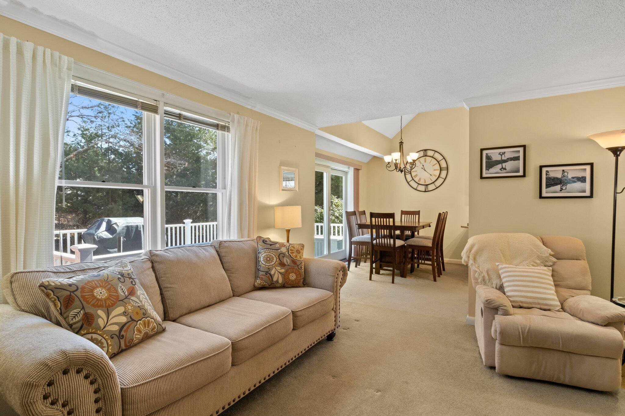 91 Shellback Way, Unit N Mashpee, MA 02649 - Photo 11 of 40 a living room with furniture and a large window