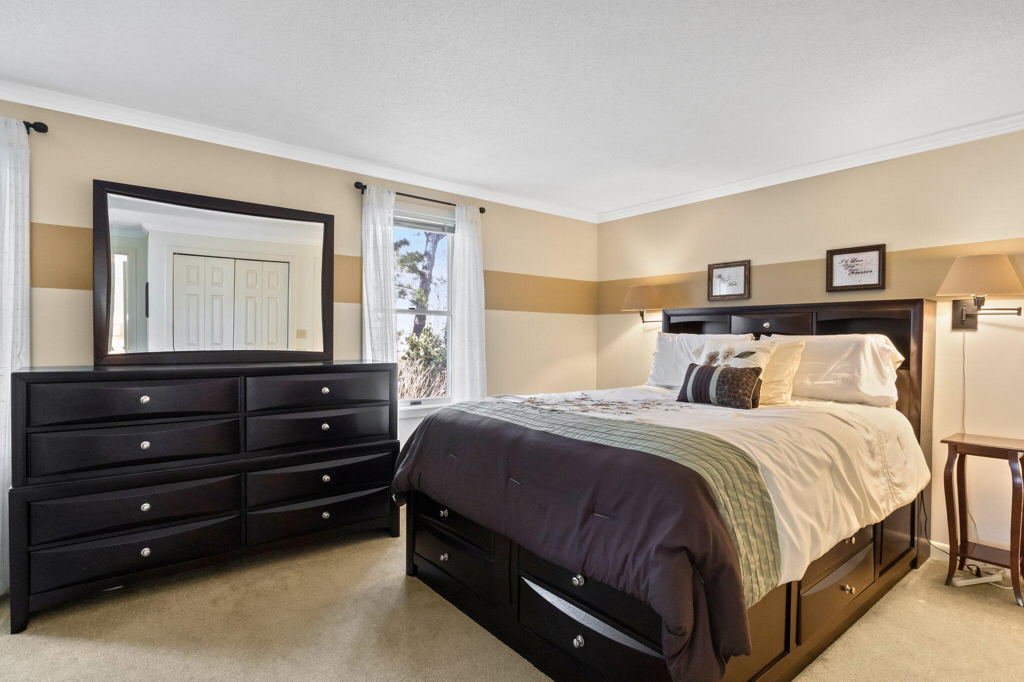 91 Shellback Way, Unit N Mashpee, MA 02649 - Photo 14 of 40 a bedroom with a bed and a closet