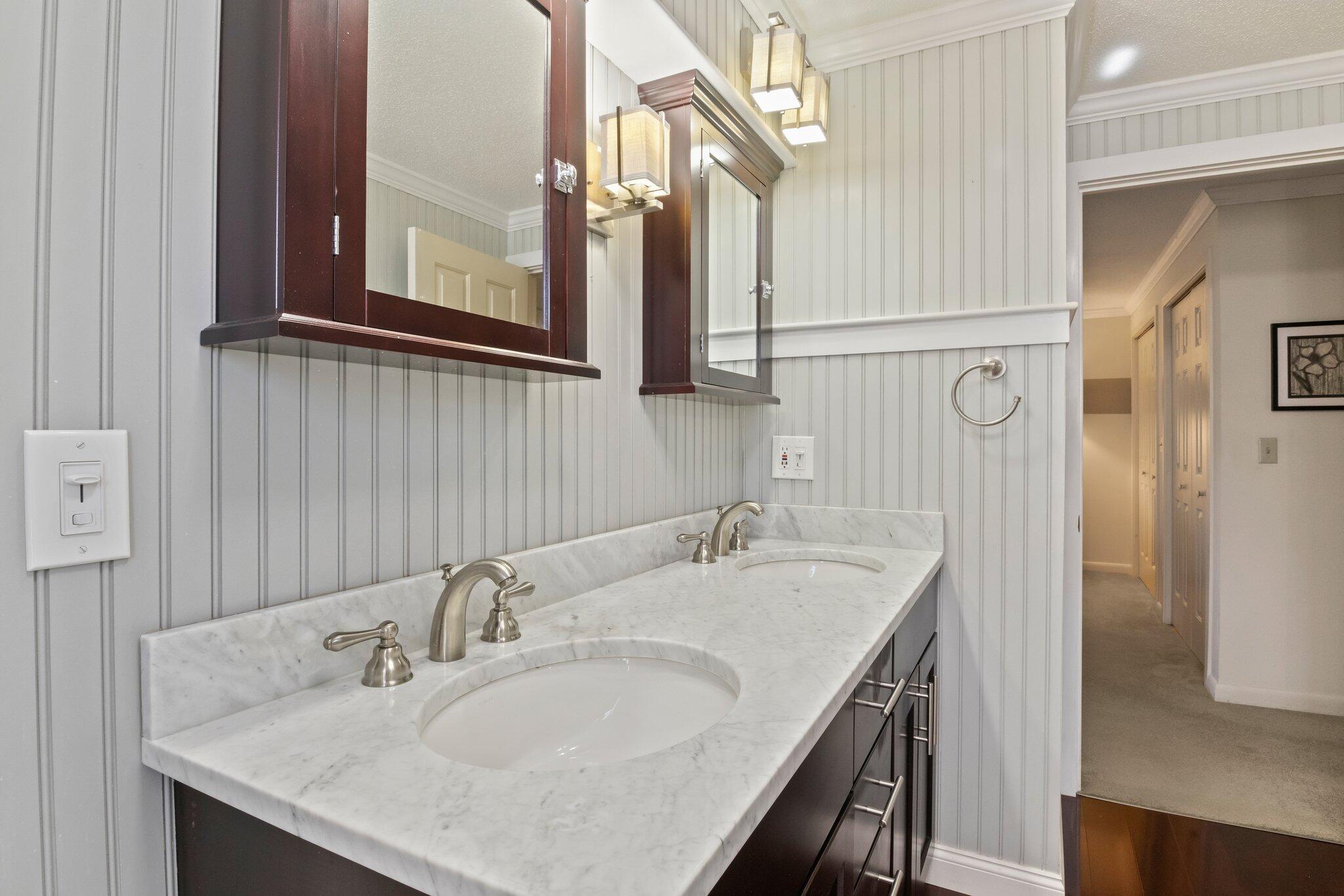 91 Shellback Way, Unit N Mashpee, MA 02649 - Photo 17 of 40 a bathroom with a granite countertop sink and a mirror