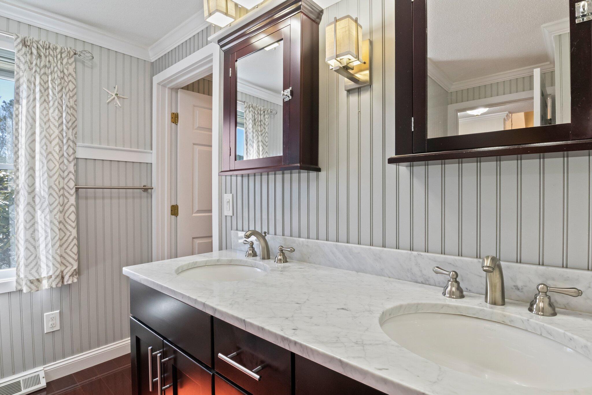 91 Shellback Way, Unit N Mashpee, MA 02649 - Photo 18 of 40 a bathroom with a granite countertop sink and a mirror