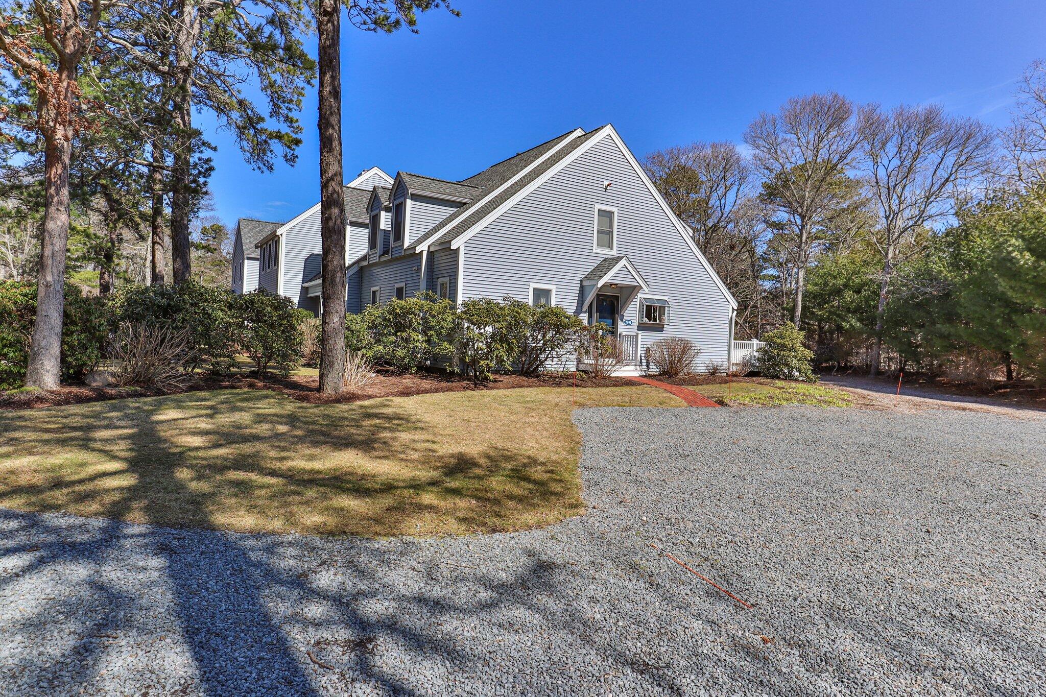91 Shellback Way, Unit N Mashpee, MA 02649 - Photo 2 of 40 a front view of a house with a yard