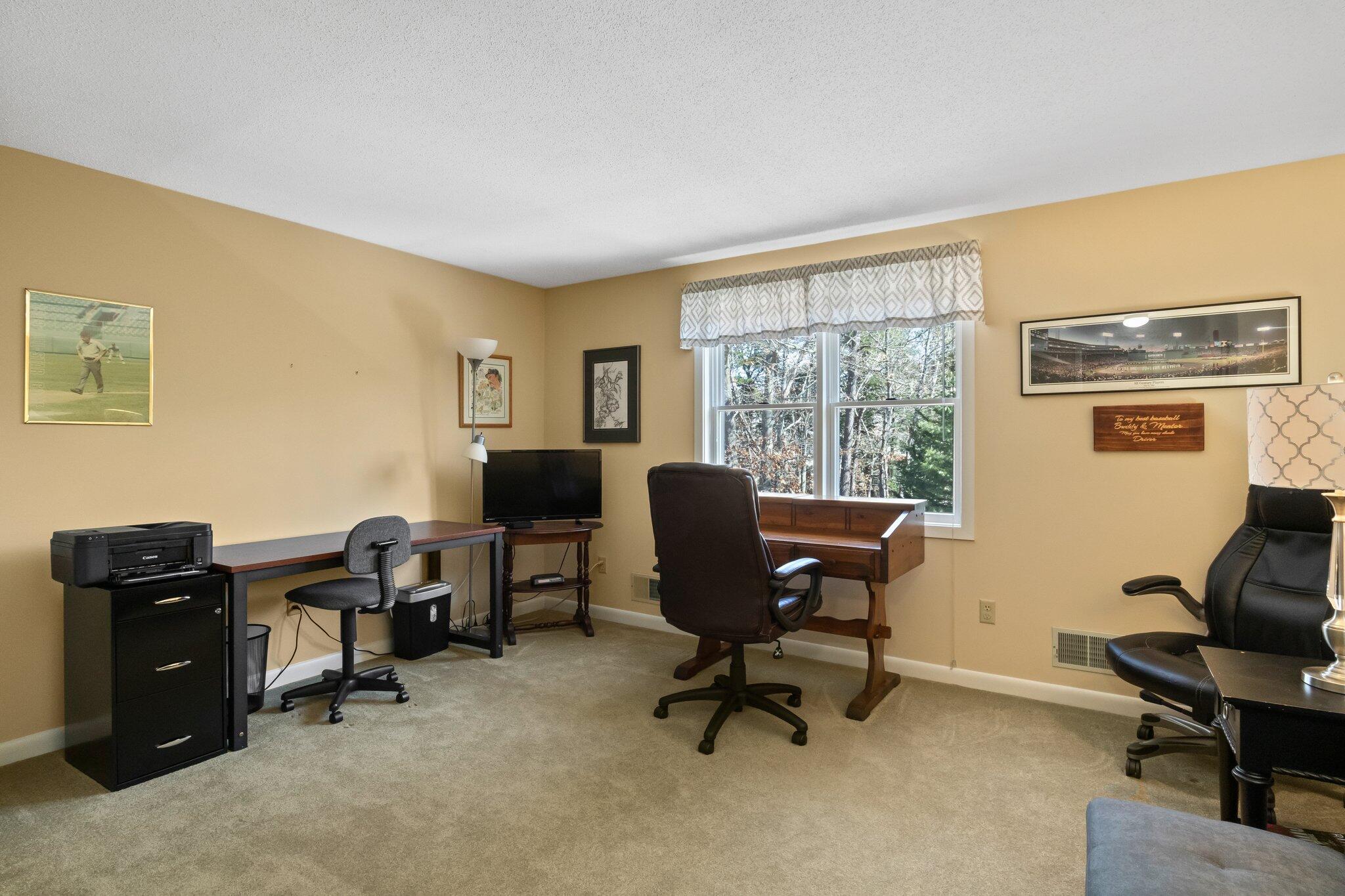 91 Shellback Way, Unit N Mashpee, MA 02649 - Photo 21 of 40 a view of a workspace with furniture and a window