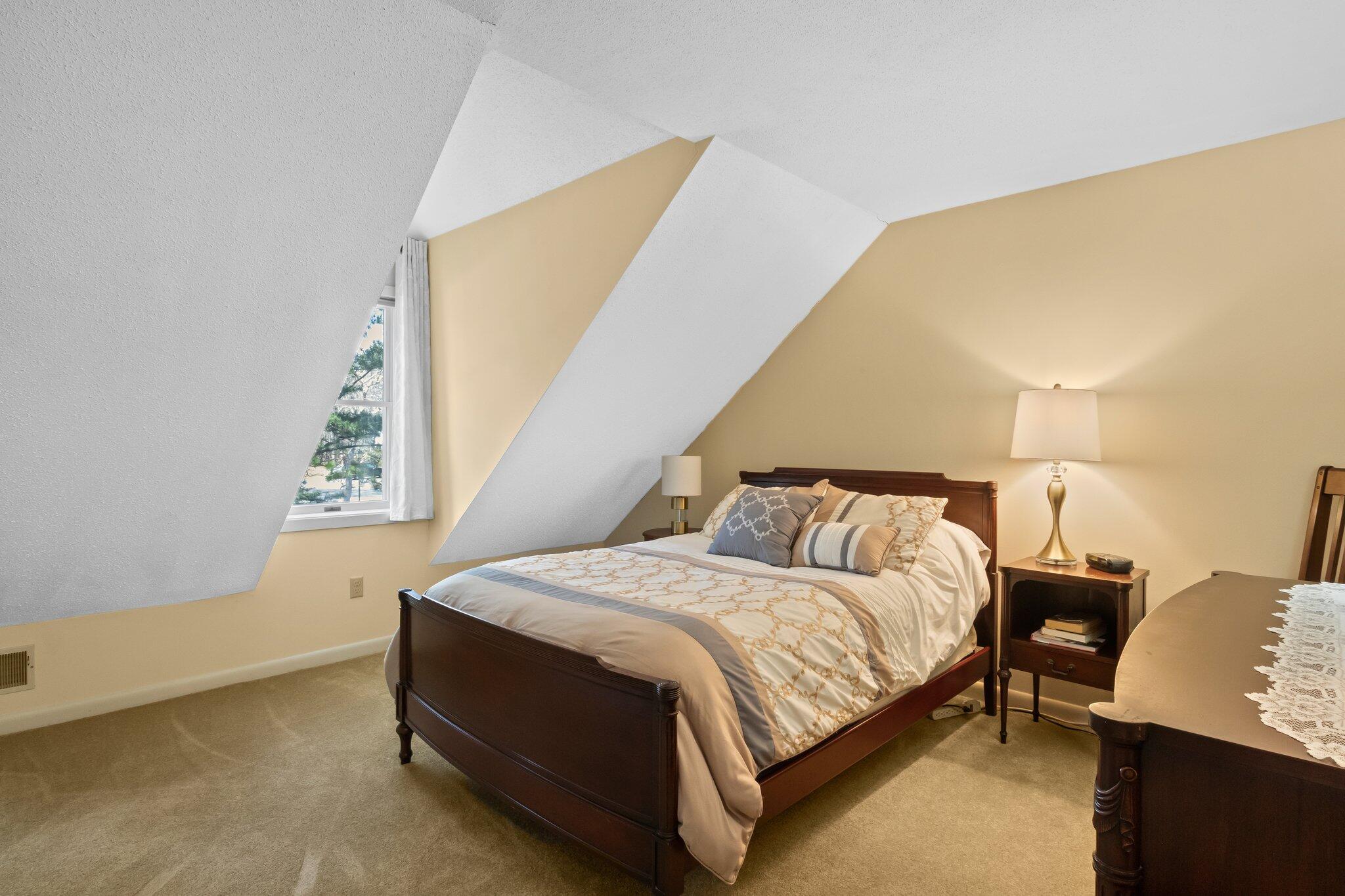 91 Shellback Way, Unit N Mashpee, MA 02649 - Photo 22 of 40 a bedroom with a bed and window