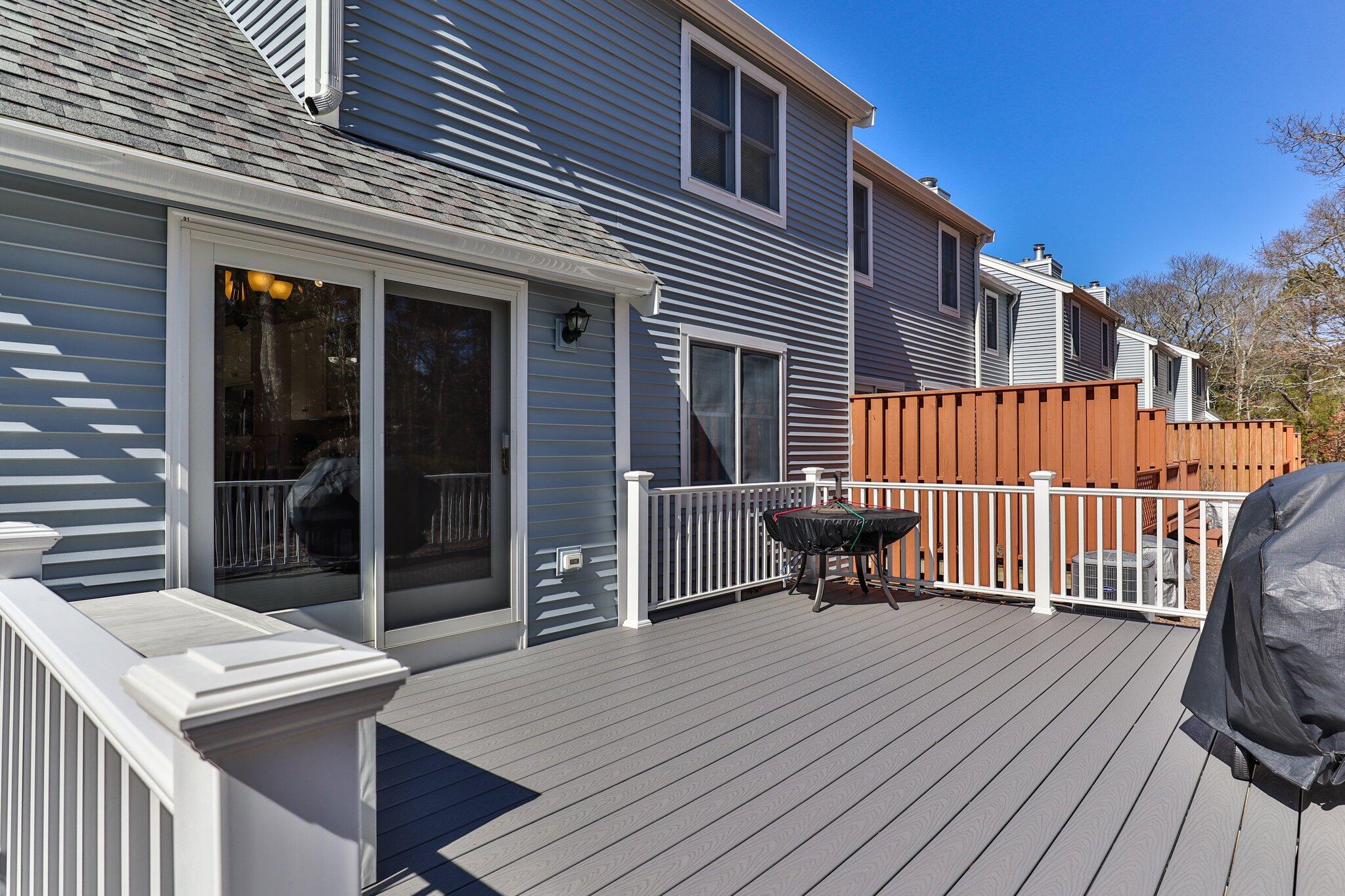 91 Shellback Way, Unit N Mashpee, MA 02649 - Photo 25 of 40 a view of a patio with a table and chairs