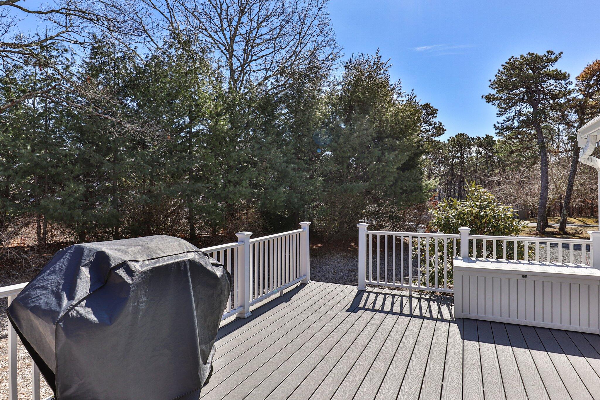 91 Shellback Way, Unit N Mashpee, MA 02649 - Photo 26 of 40 a view of deck with furniture and trees