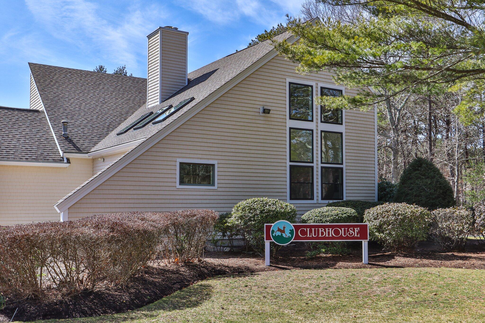 91 Shellback Way, Unit N Mashpee, MA 02649 - Photo 30 of 40 a wooden house with outdoor space