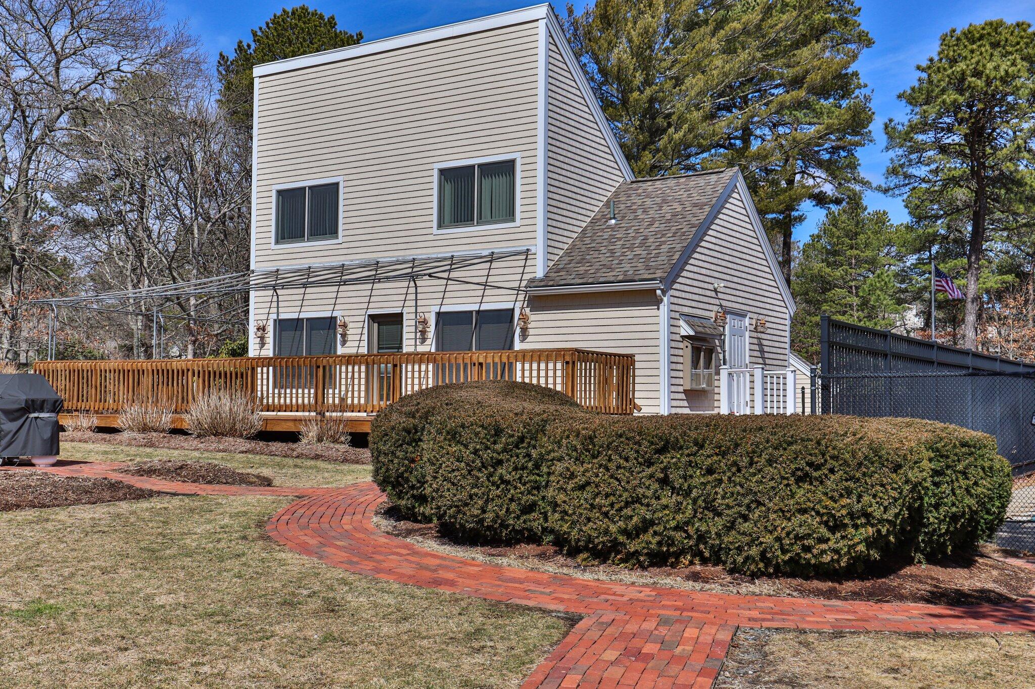 91 Shellback Way, Unit N Mashpee, MA 02649 - Photo 31 of 40 a view of a house with a patio