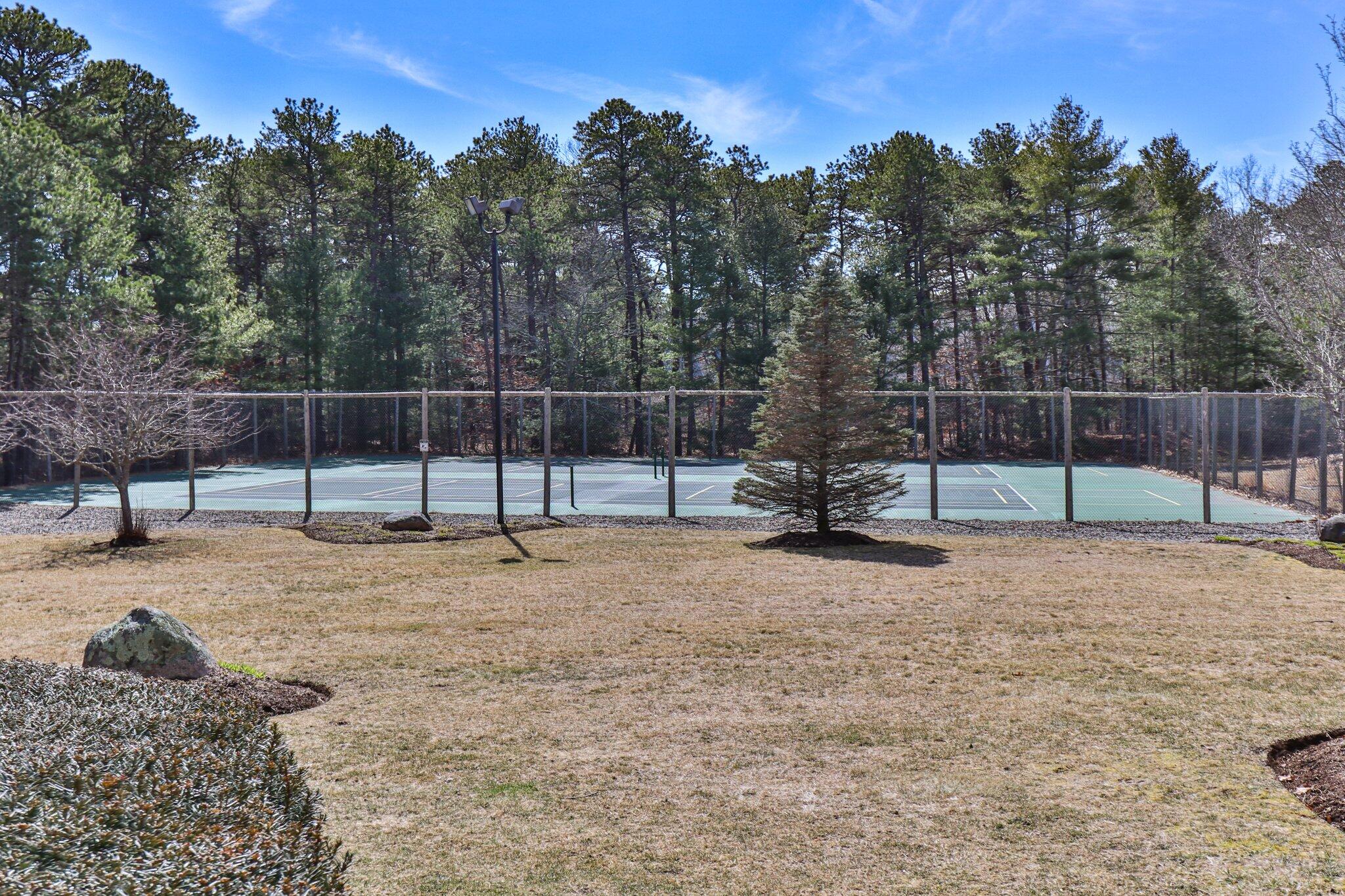 91 Shellback Way, Unit N Mashpee, MA 02649 - Photo 35 of 40 a view of a yard with a entertaining space