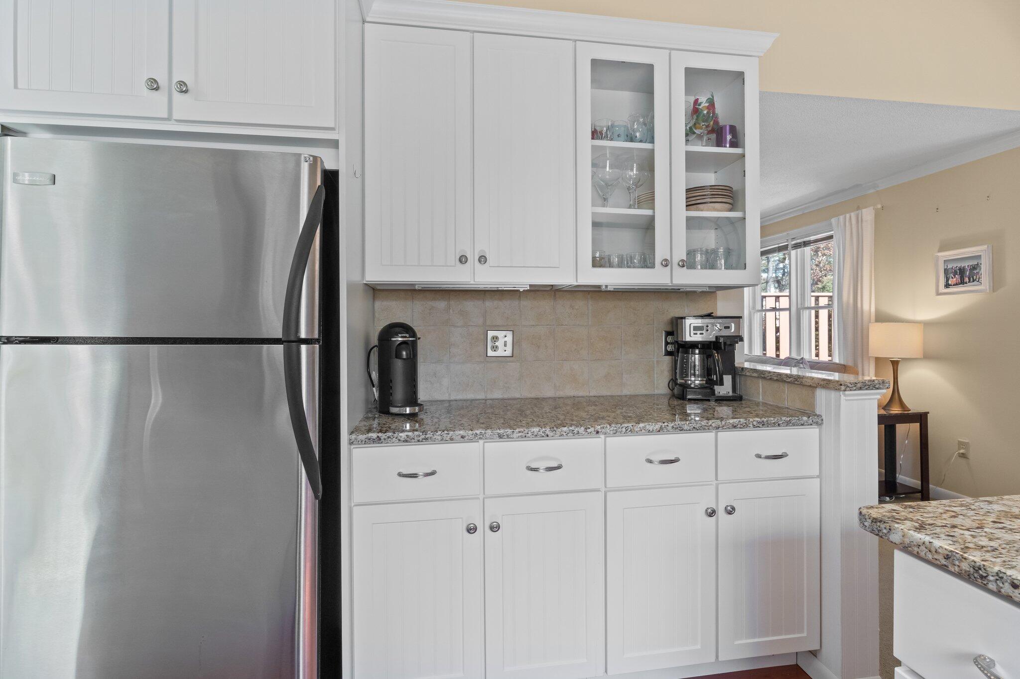 91 Shellback Way, Unit N Mashpee, MA 02649 - Photo 6 of 40 a kitchen with stainless steel appliances granite countertop a refrigerator and a sink