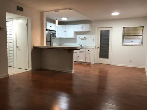 a kitchen with stainless steel appliances granite countertop a sink and cabinets