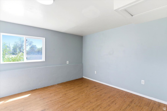 1613 Sunset Road Lake Point, UT 84074 - Photo 22 of 33 Light blue painted walls with white trim and wood-finish flooring