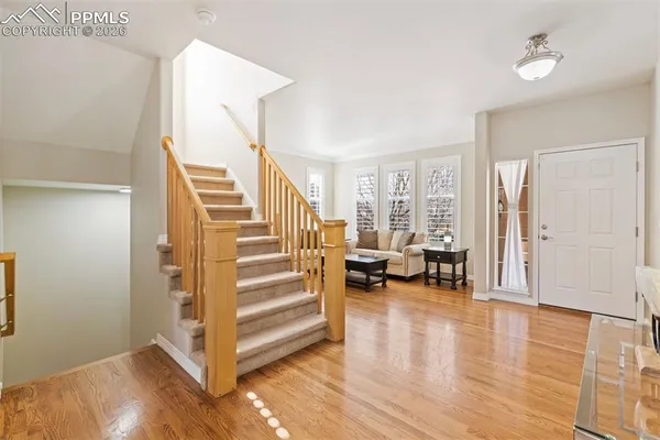 a view of a livingroom with furniture and stairs