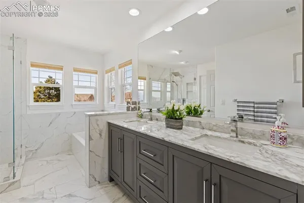 a bathroom with a bathtub and a shower