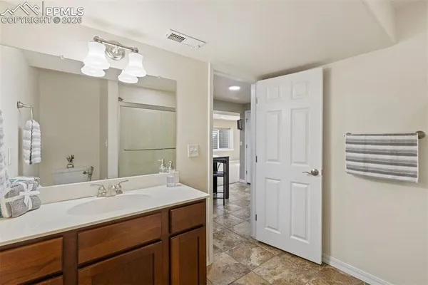 a bathroom with a bathtub shower sink and toilet