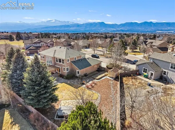 an aerial view of a house with a lake view