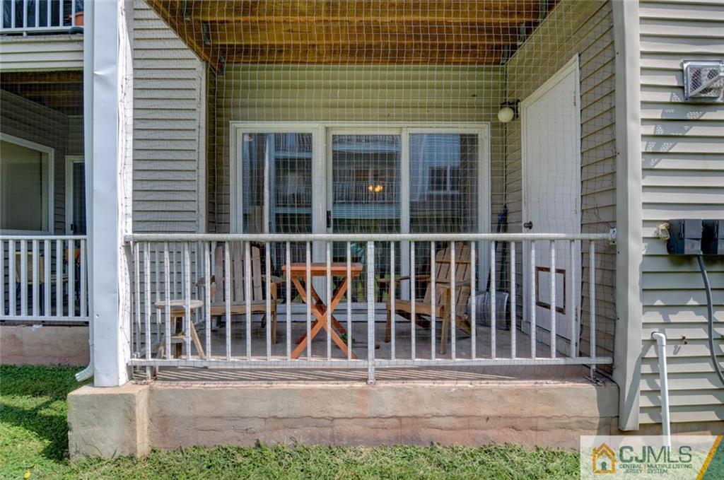 512 Edpas Road, Unit 512 New Brunswick, NJ 08901 - Photo 1 of 19 a view of a house with a small window and wooden fence