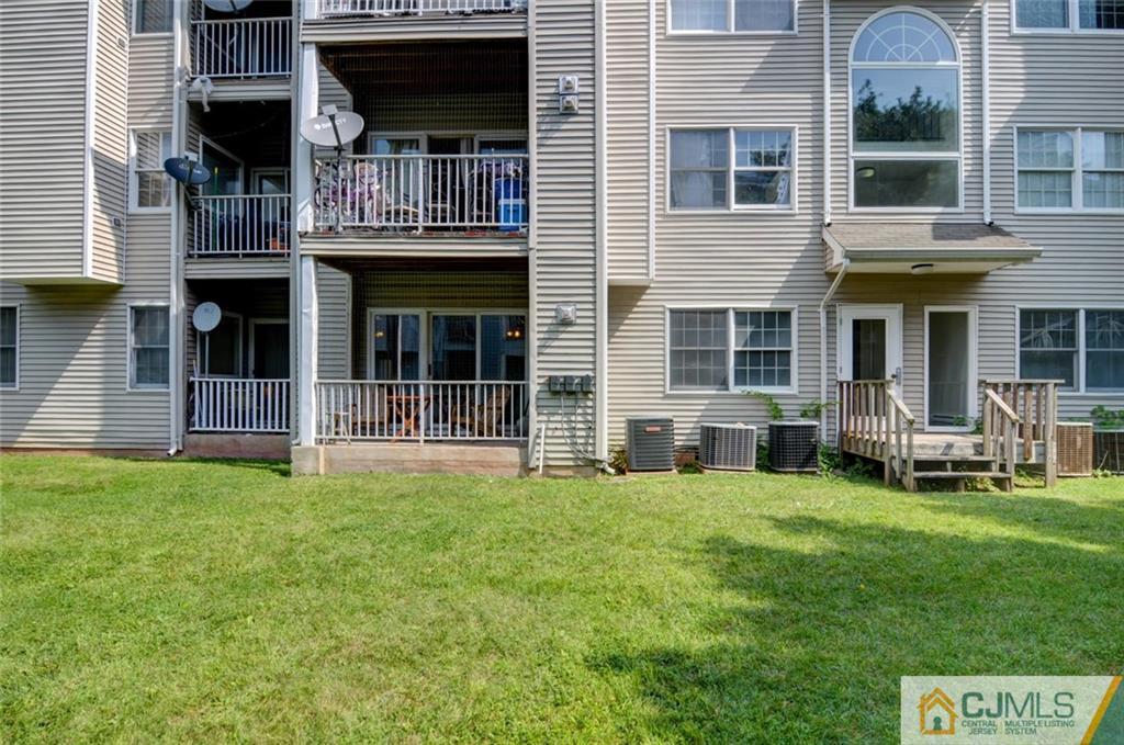 512 Edpas Road, Unit 512 New Brunswick, NJ 08901 - Photo 18 of 19 a view of a house with a yard and sitting area