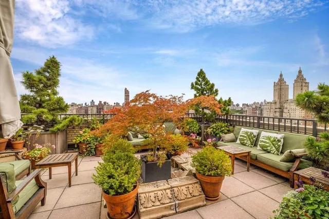 a kitchen with a stove and a wooden floor