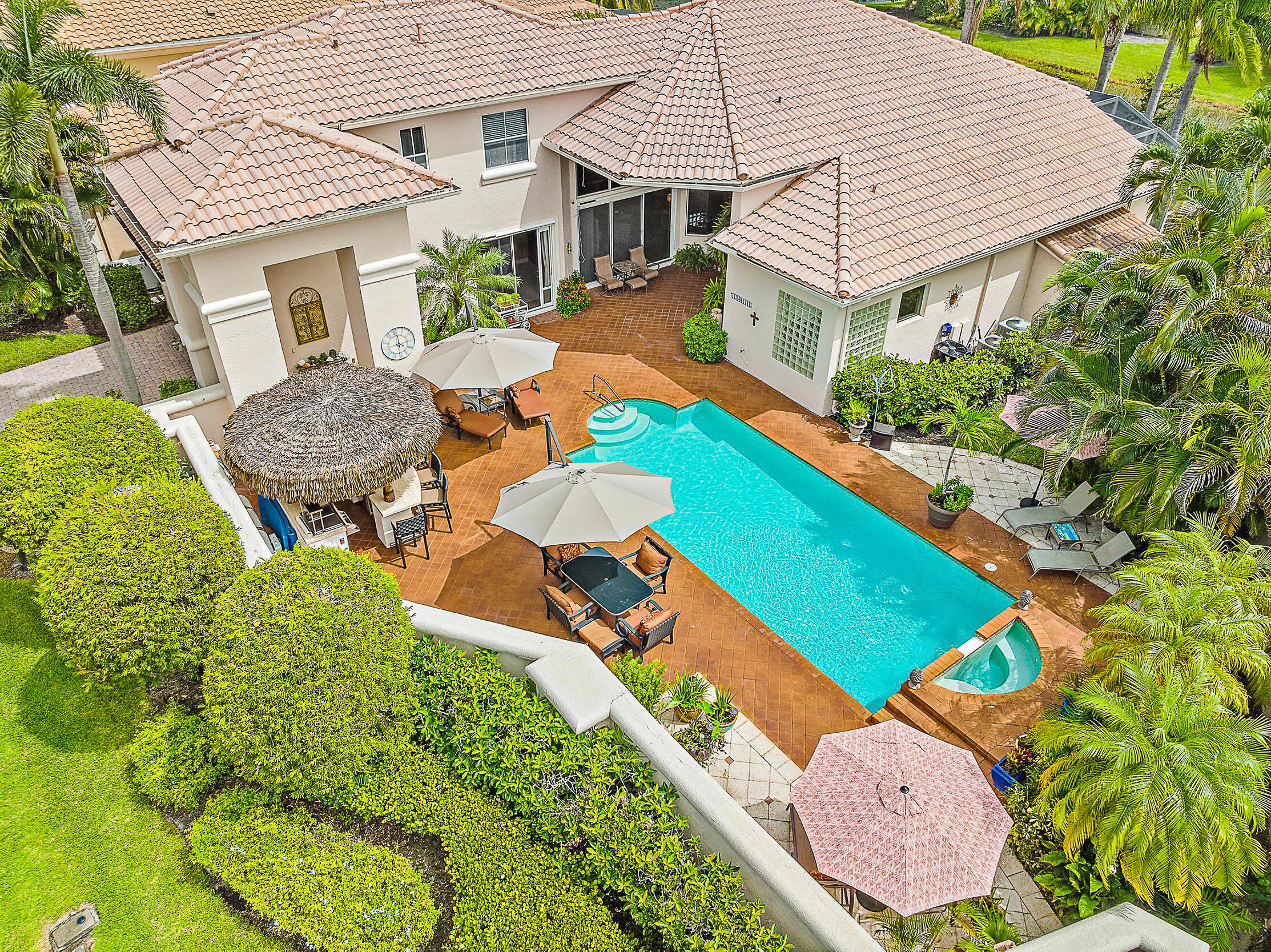 an aerial view of a house with pool