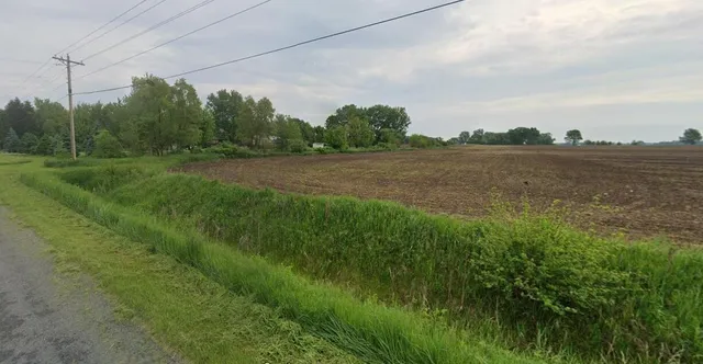 a bathroom with a shower and a sink