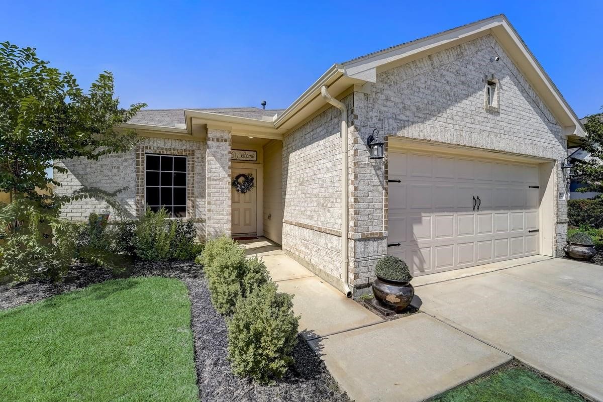 8827 Willet Street Baytown, TX 77521 - Photo 1 of 18 a view of house with yard