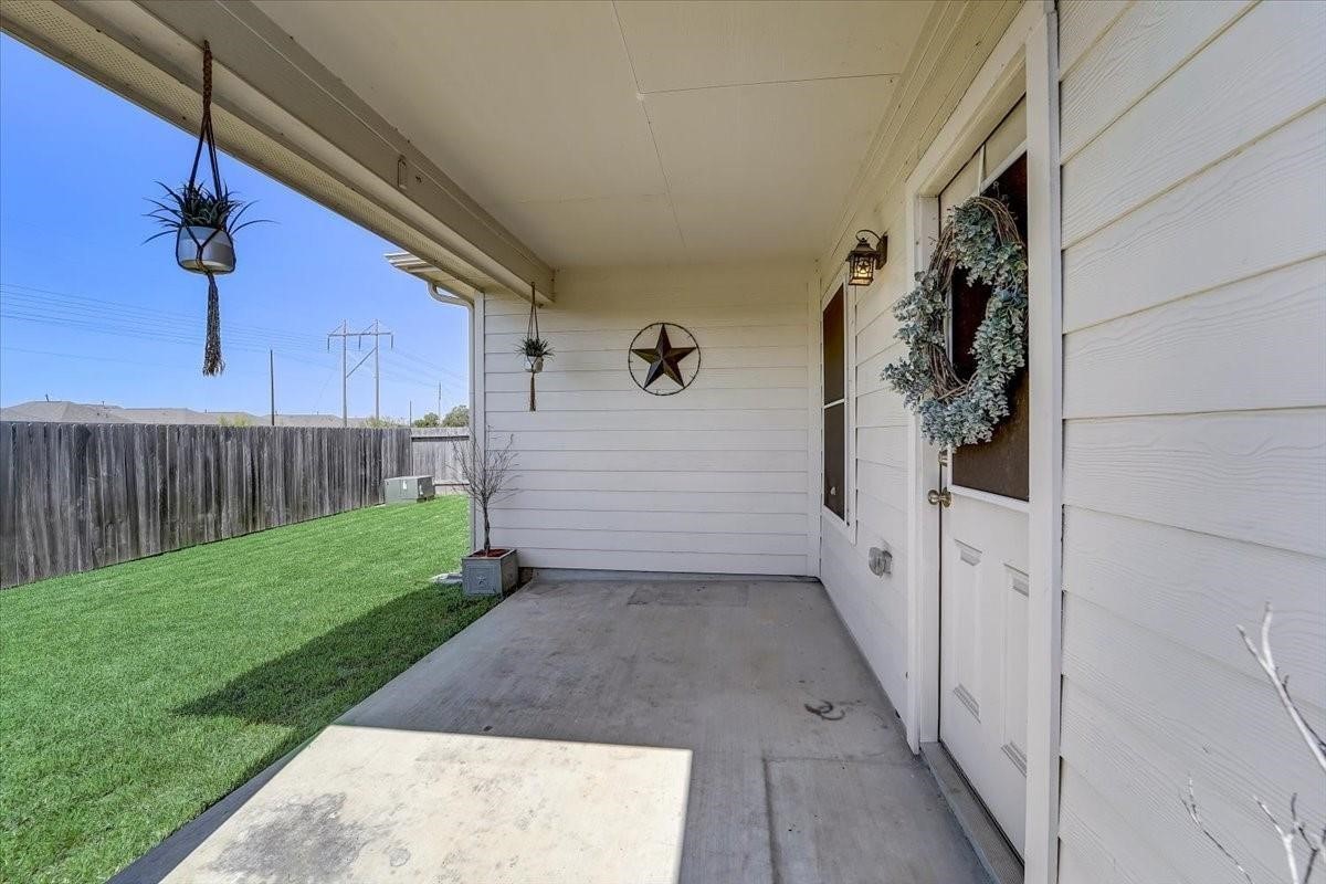 8827 Willet Street Baytown, TX 77521 - Photo 18 of 18 a view of a pathway of a house with wooden fence