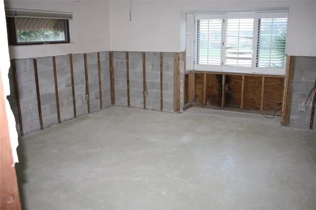 a view of an empty room with a fireplace