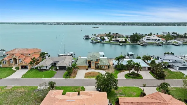 an aerial view of a house with a lake view