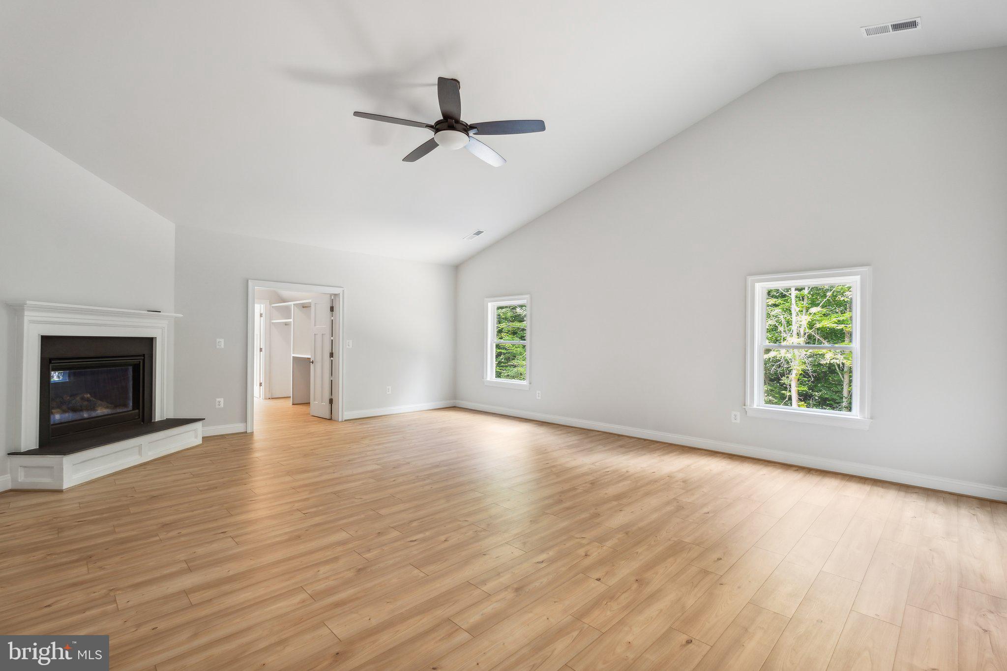 13749 Orlando Road Nokesville, VA 20181 - Photo 13 of 42 a view of empty room with wooden floor and fireplace