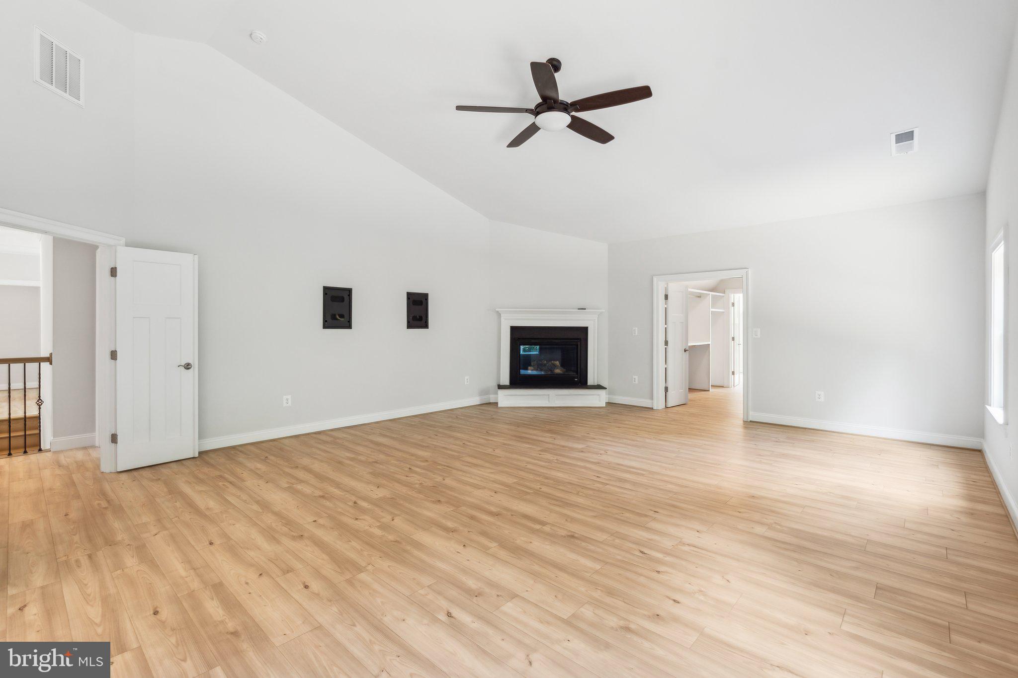 13749 Orlando Road Nokesville, VA 20181 - Photo 14 of 42 a view of empty room with wooden floor and fireplace