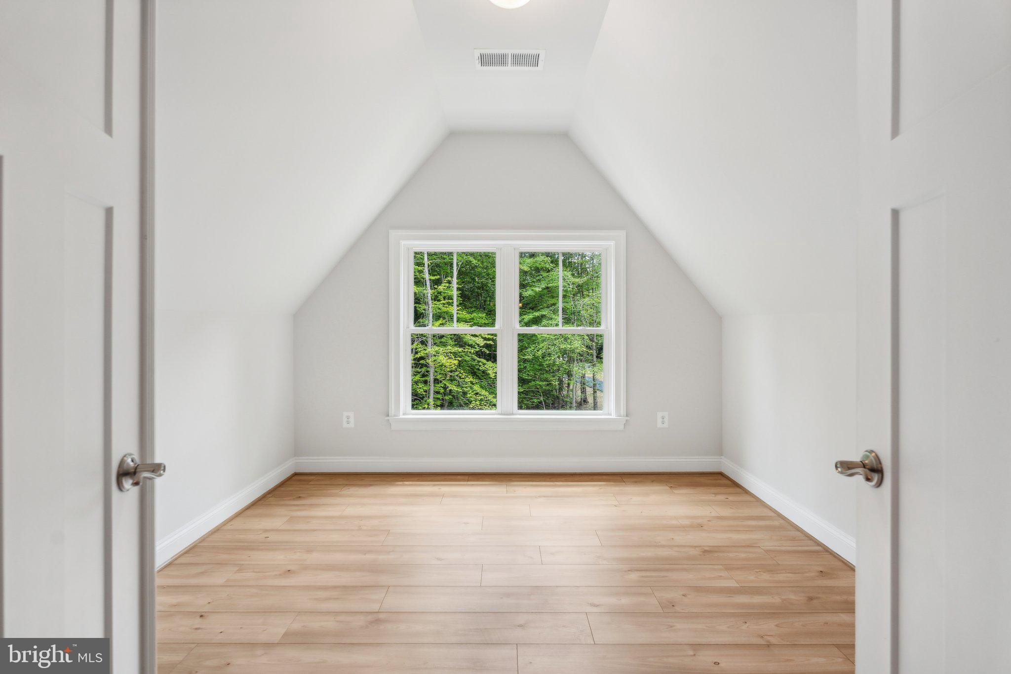 13749 Orlando Road Nokesville, VA 20181 - Photo 16 of 42 an empty room with wooden floor and windows