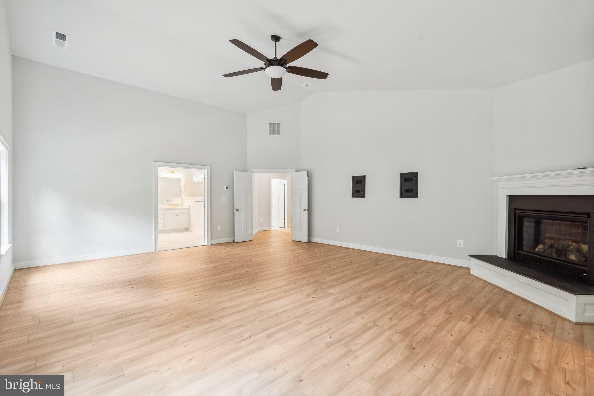 13749 Orlando Road Nokesville, VA 20181 - Photo 17 of 42 a view of empty room with wooden floor and fireplace