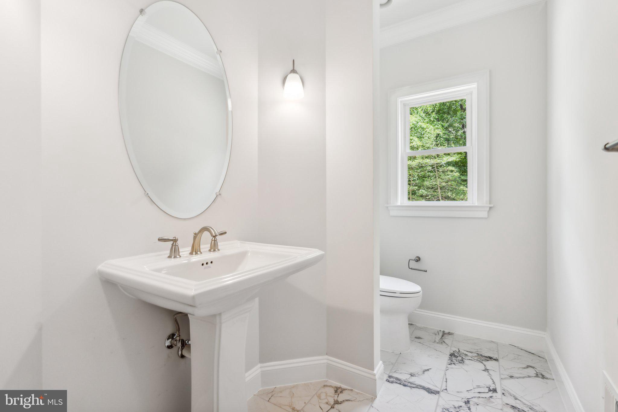 13749 Orlando Road Nokesville, VA 20181 - Photo 27 of 42 a bathroom with a sink toilet and a mirror