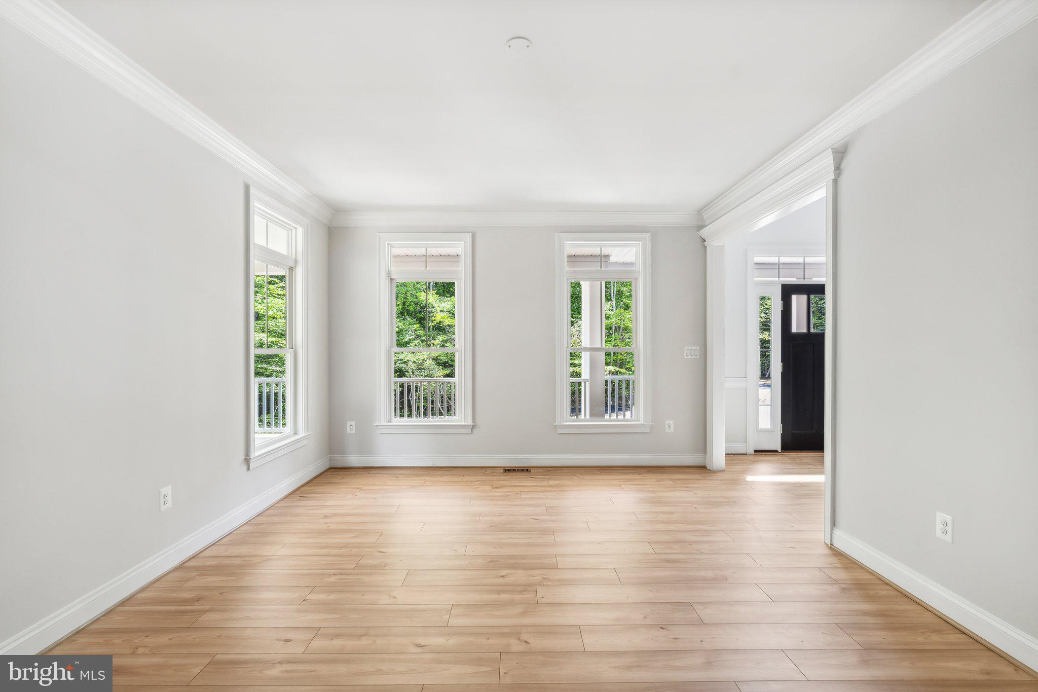 13749 Orlando Road Nokesville, VA 20181 - Photo 28 of 42 an empty room with wooden floor and windows
