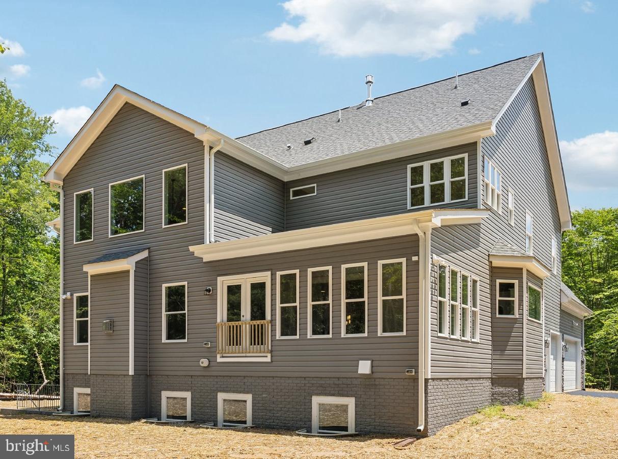 13749 Orlando Road Nokesville, VA 20181 - Photo 3 of 42 a front view of a house with a yard