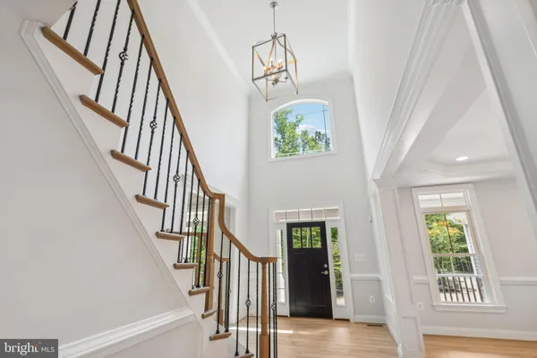 a view of an entryway with wooden floor